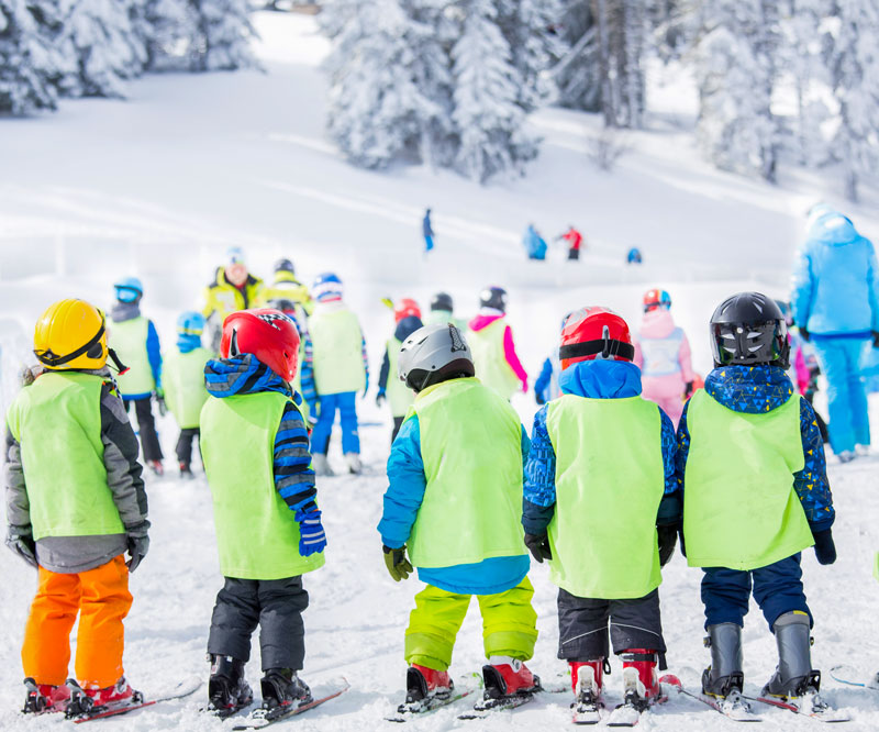 Group of children learing to ski